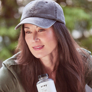 The Hat on a model holding Not Today Grey